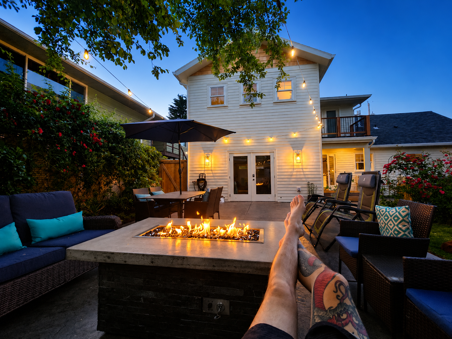Custom backyard patio and fire pit entertainment area at Southeast Portland home addition project