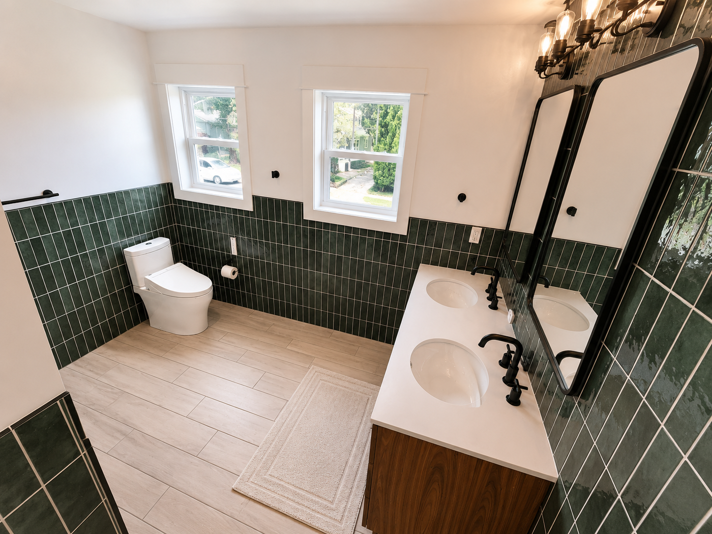 Custom double vanity and green tile primary bathroom remodel in Portland home addition