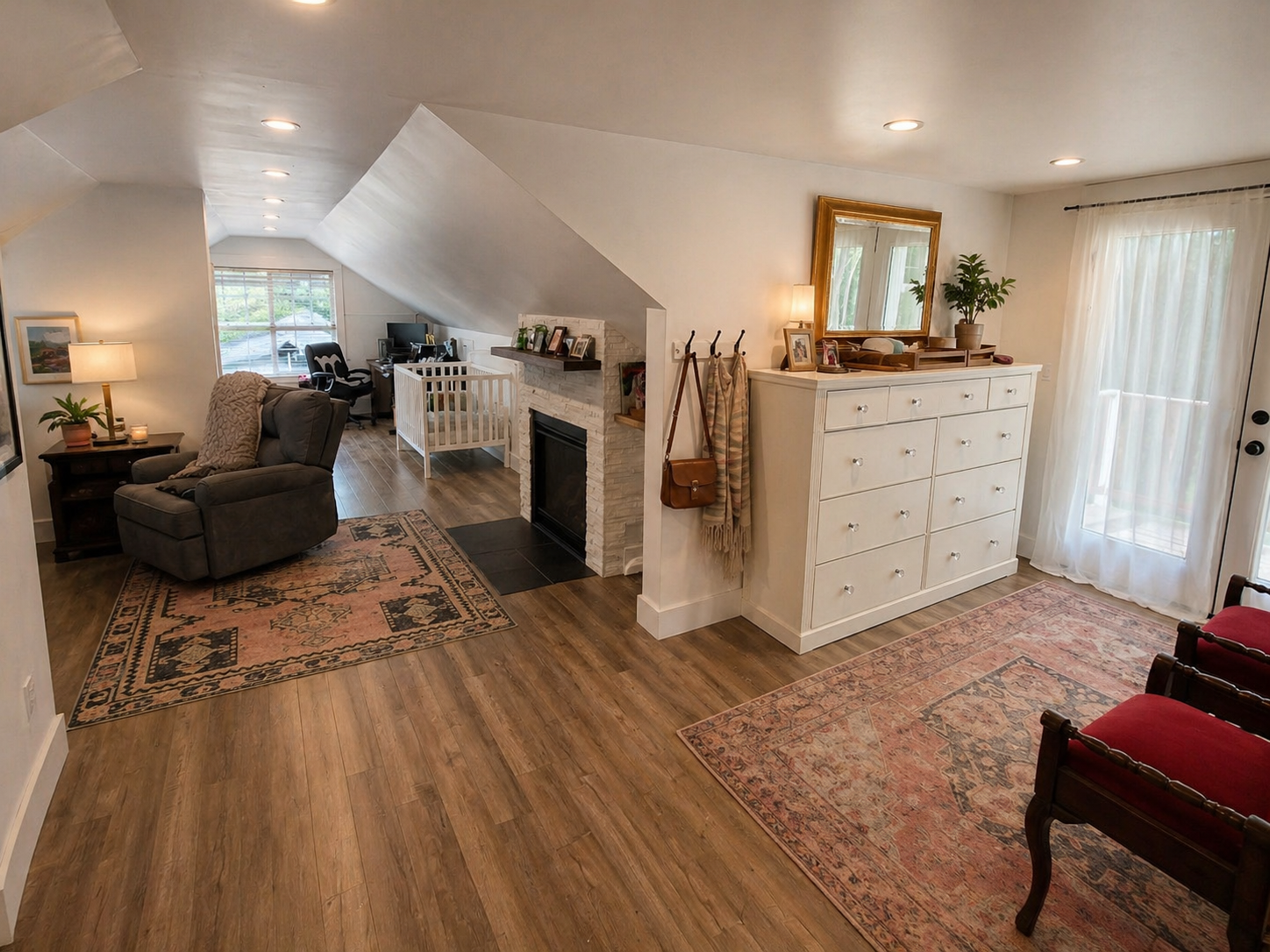 Custom primary suite addition with fireplace and private balcony in Southeast Portland home addition