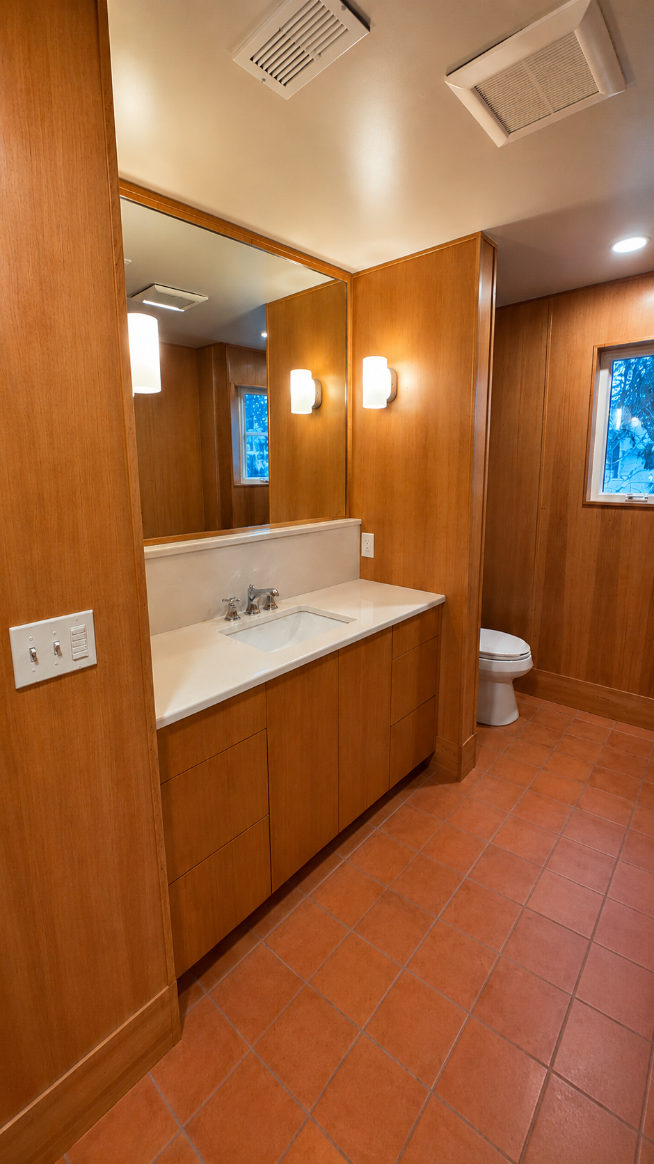 Custom bathroom vanity with quartz countertop in the Nixon basement ADU conversion.