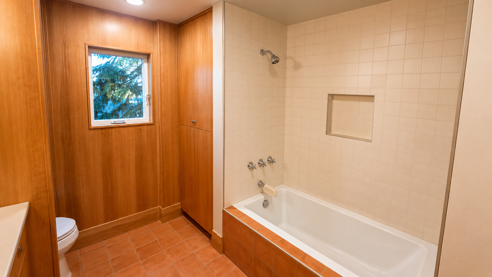 Walk-in tile shower with glass enclosure in the Nixon basement ADU bathroom.